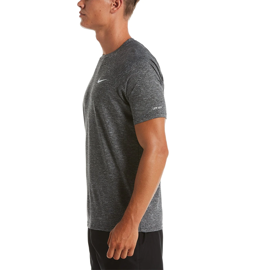 Man wearing a gray Nike t-shirt on a white background