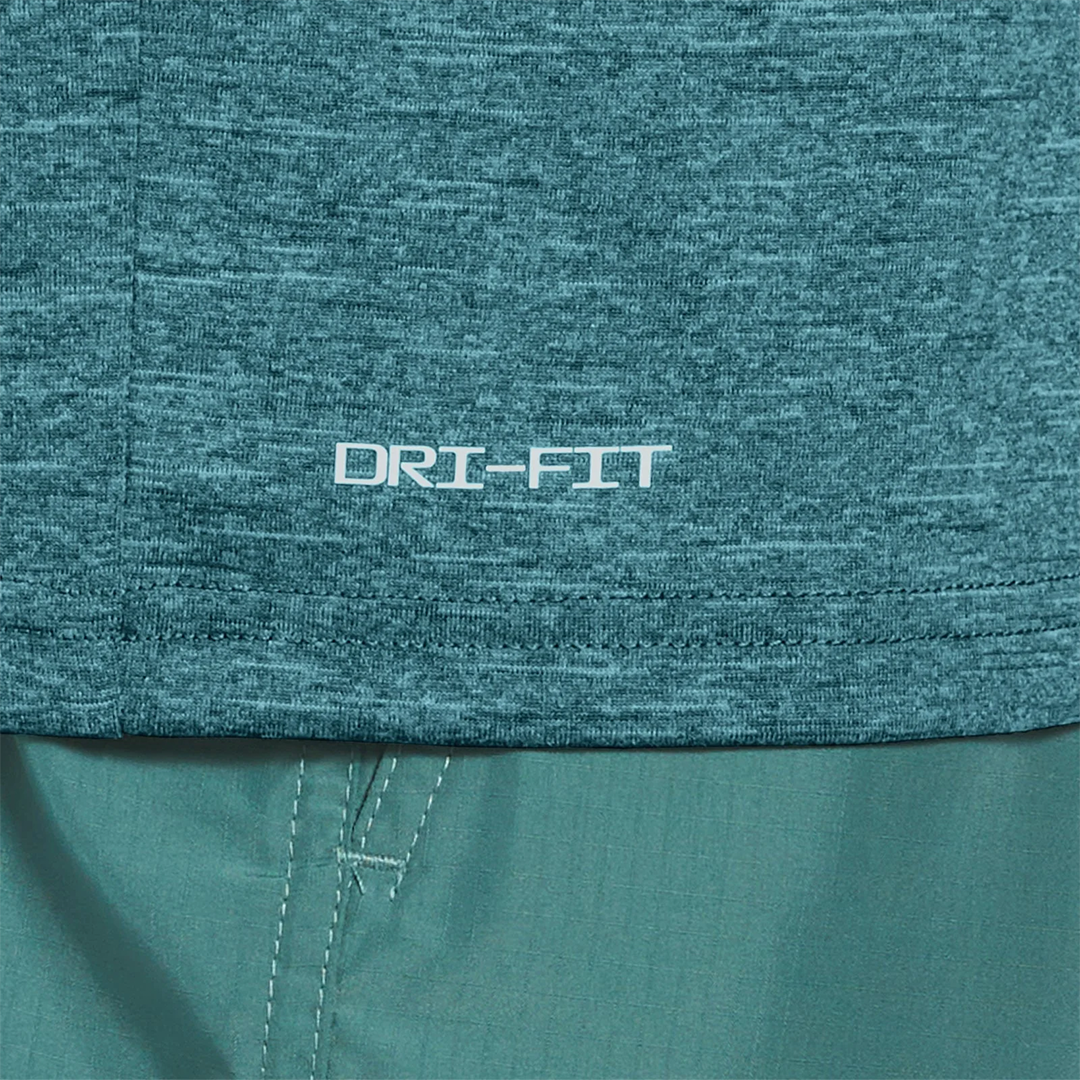 Close-up of teal fabric with 'DRI-FIT' logo