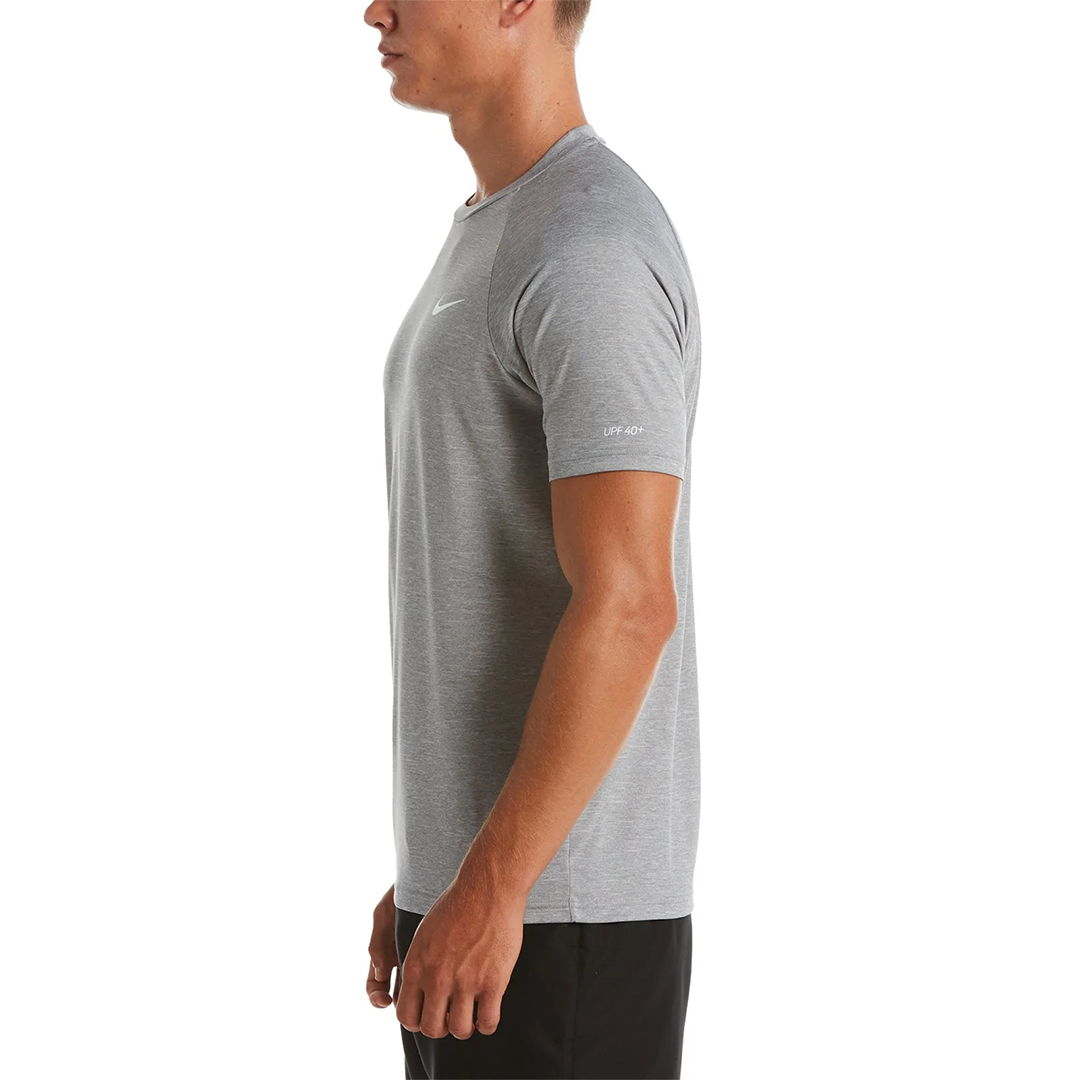 Man wearing a gray Nike t-shirt on a white background