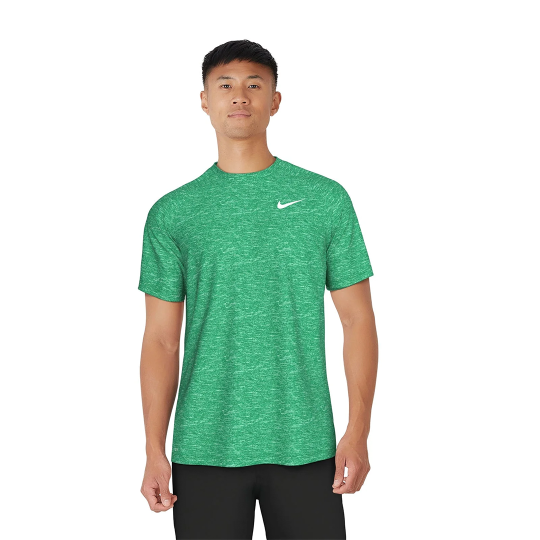 Person wearing a green Nike t-shirt on a white background
