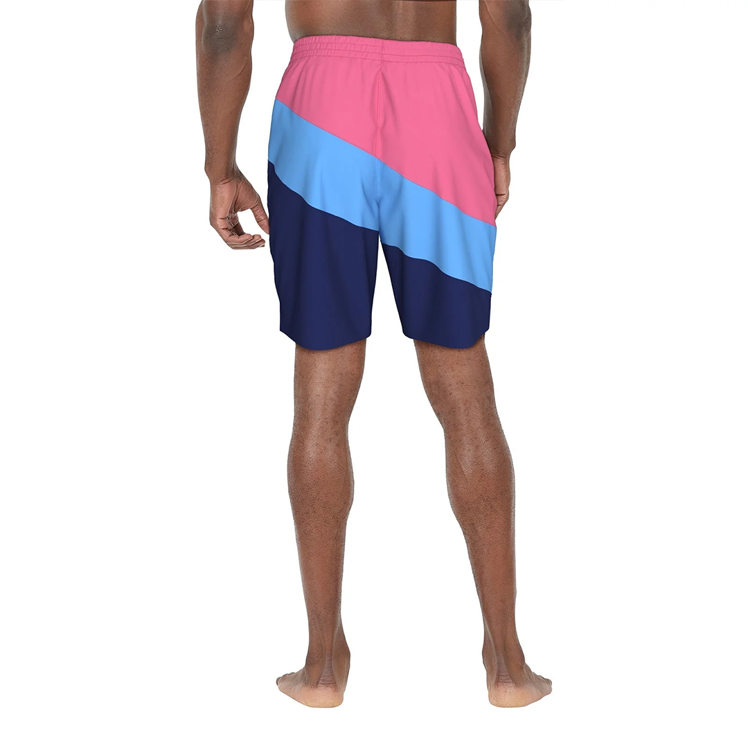 Color-blocked swim shorts with pink, blue, and navy sections on a white background.