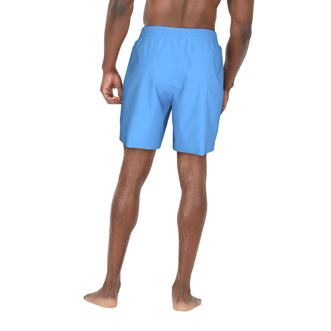 Person wearing light blue swim shorts on a white background