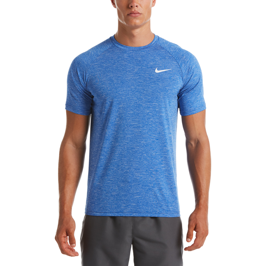 Person wearing a blue Nike athletic shirt on a white background
