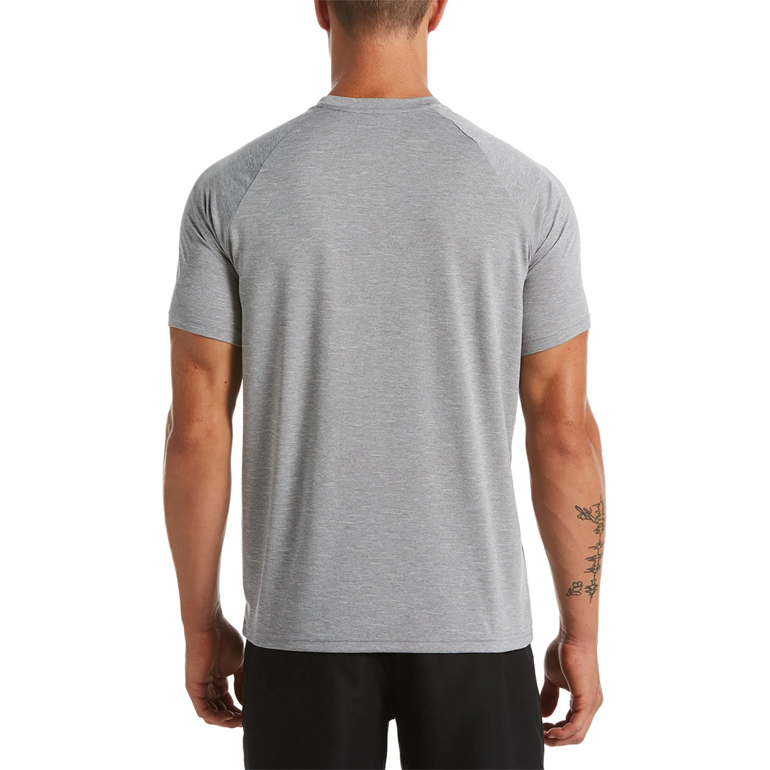Person wearing a gray athletic shirt on a white background
