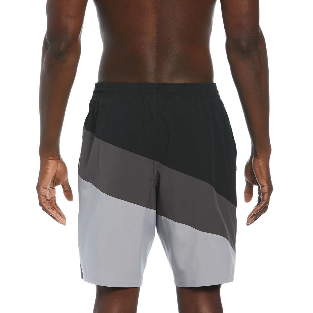 Color-blocked athletic shorts worn by a person on a white background