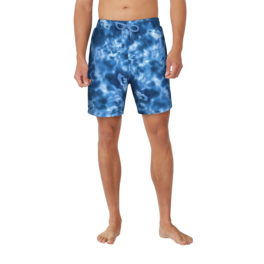 Blue tie-dye swim shorts worn by a person on a white background