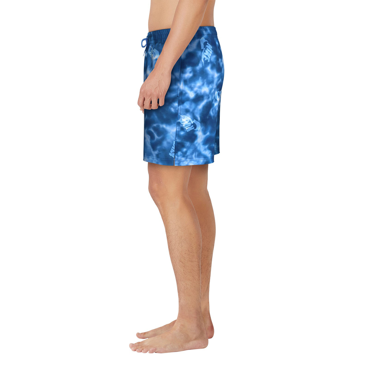 Blue tie-dye swim shorts worn by a person on a white background
