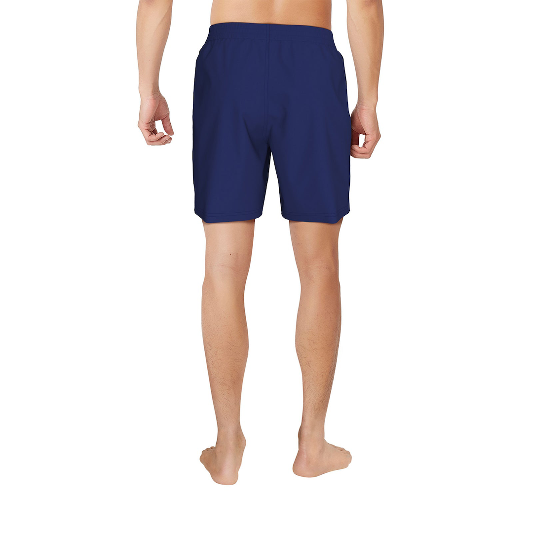 Person wearing navy blue shorts on a white background