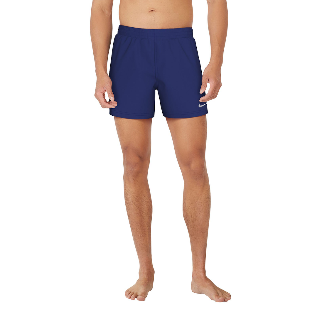Person wearing blue swim shorts with a Nike logo on a white background