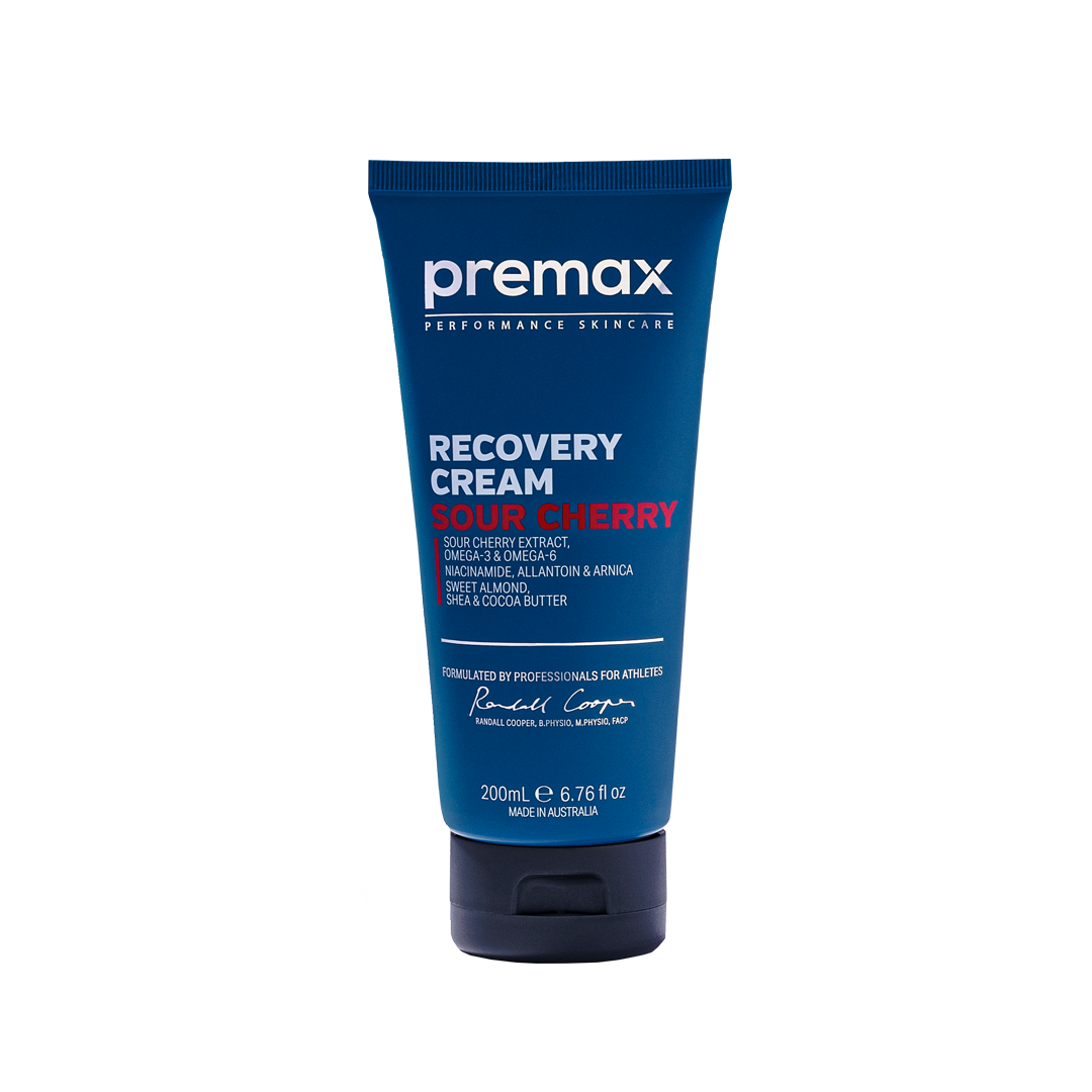 Blue tube of premax Recovery Cream Sour Cherry on a white background
