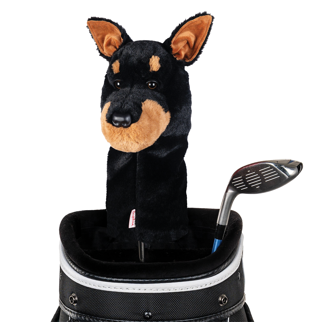Plush dog toy in a golf bag with a golf club on a white background